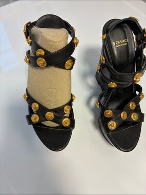 Versace Black Leather Strappy Sandals with Gold Medusa Buttons in size 36.5 EU